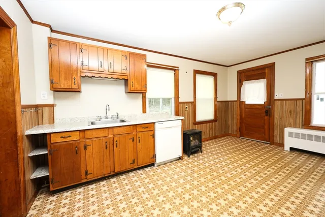 a spacious bathroom with a granite countertop sink and a large mirror