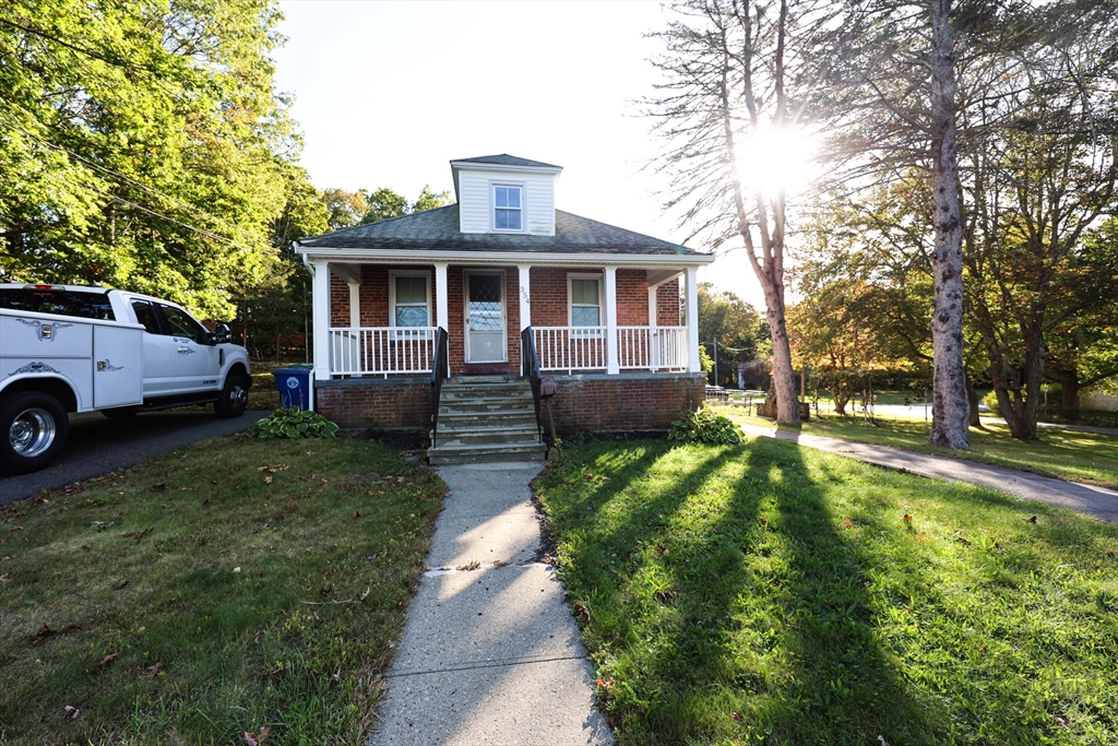 354 Pond Street, Unit 354 Braintree, MA 02184 - Photo 28 of 30 a front view of a house with a yard