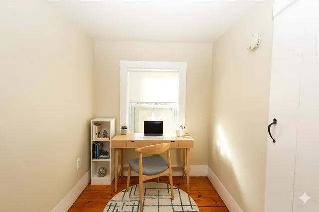 a room with a table and chairs