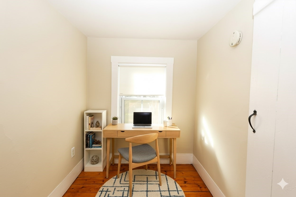 354 Pond Street, Unit 354 Braintree, MA 02184 - Photo 6 of 30 a room with a table and chairs