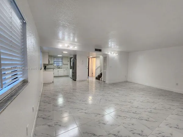 a view of front door with wooden floor