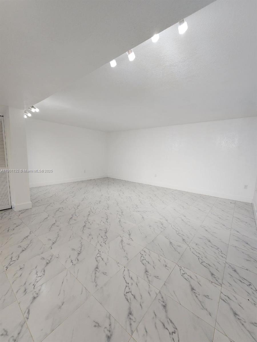 5100 West 12th Lane, Unit E7 Hialeah, FL 33012 - Photo 19 of 35 a view of empty room