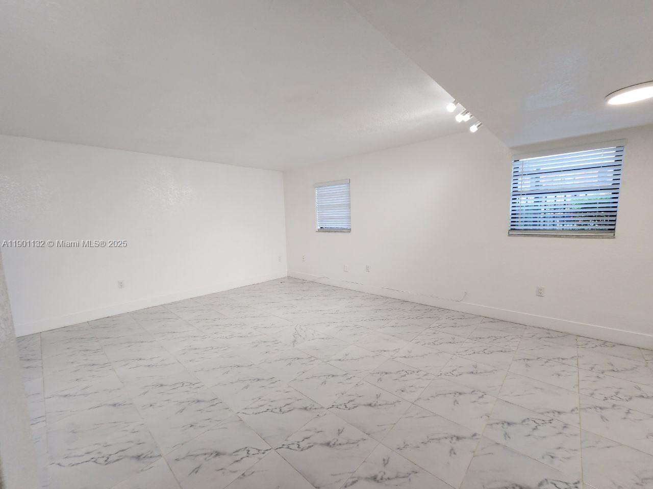 5100 West 12th Lane, Unit E7 Hialeah, FL 33012 - Photo 20 of 35 wooden floor in a room