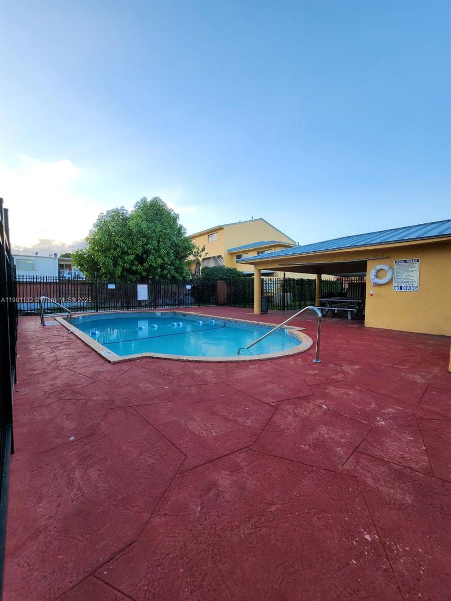 5100 West 12th Lane, Unit E7 Hialeah, FL 33012 - Photo 35 of 35 a view of outdoor space with swimming pool