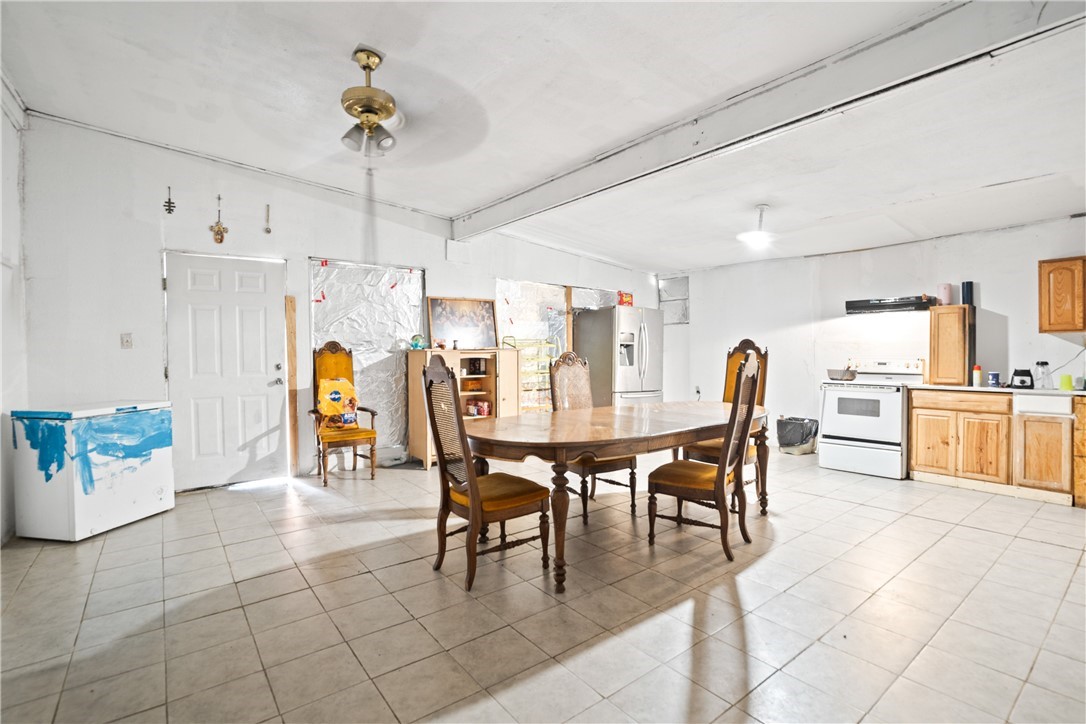 128 Northwest 6th Street Premont, TX 78375 - Photo 7 of 15 a view of a dining room with furniture and a chandelier