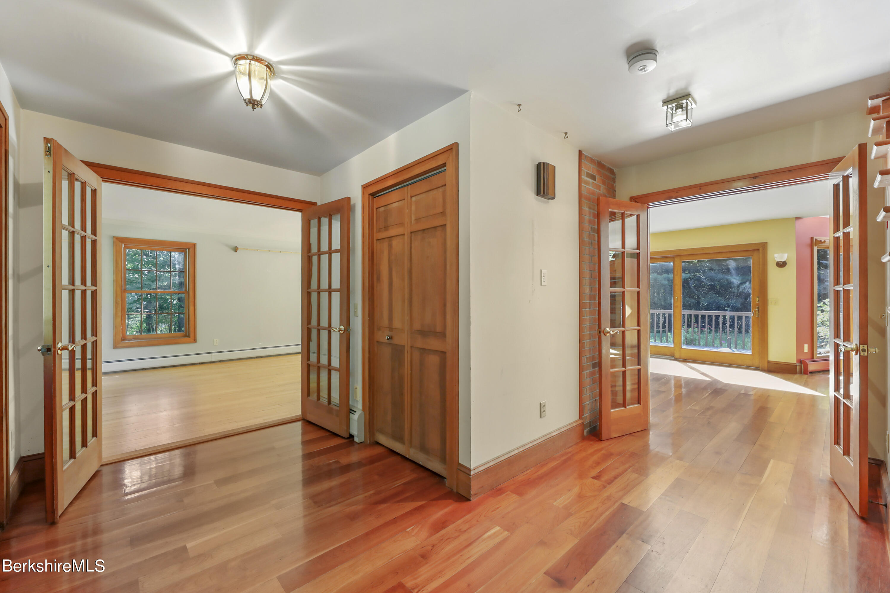 7 Fern Hill Road Great Barrington, MA 01230 - Photo 11 of 60 a view of empty room with wooden floor and fan