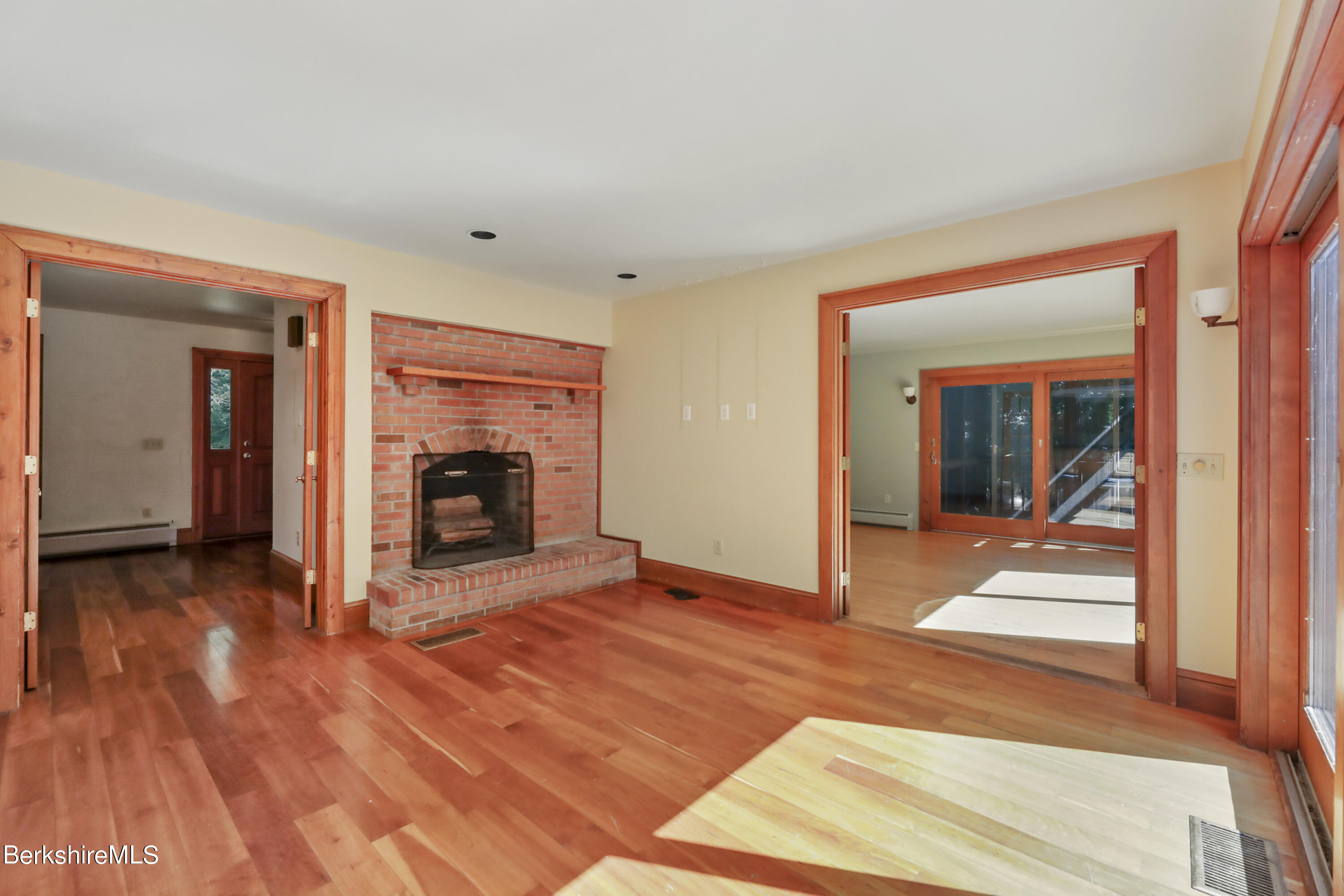 7 Fern Hill Road Great Barrington, MA 01230 - Photo 17 of 60 a view of a room with wooden floor and a fireplace