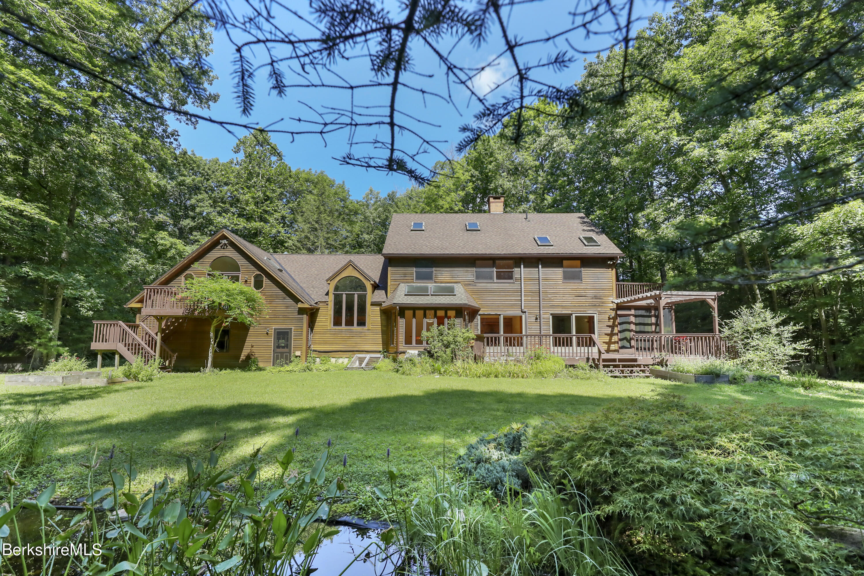 7 Fern Hill Road Great Barrington, MA 01230 - Photo 2 of 60 a front view of house with yard and green space