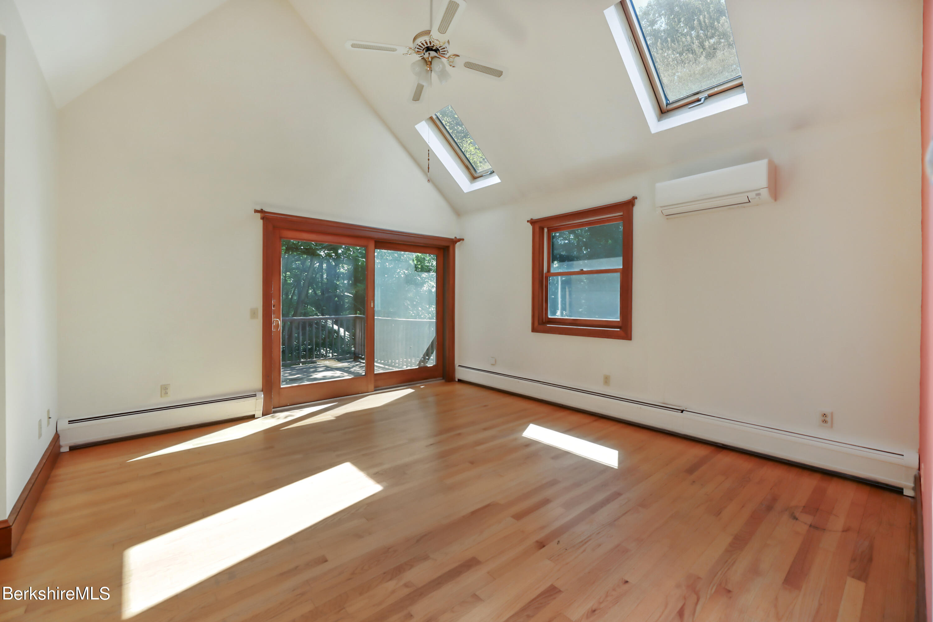 7 Fern Hill Road Great Barrington, MA 01230 - Photo 26 of 60 an empty room with wooden floor and windows