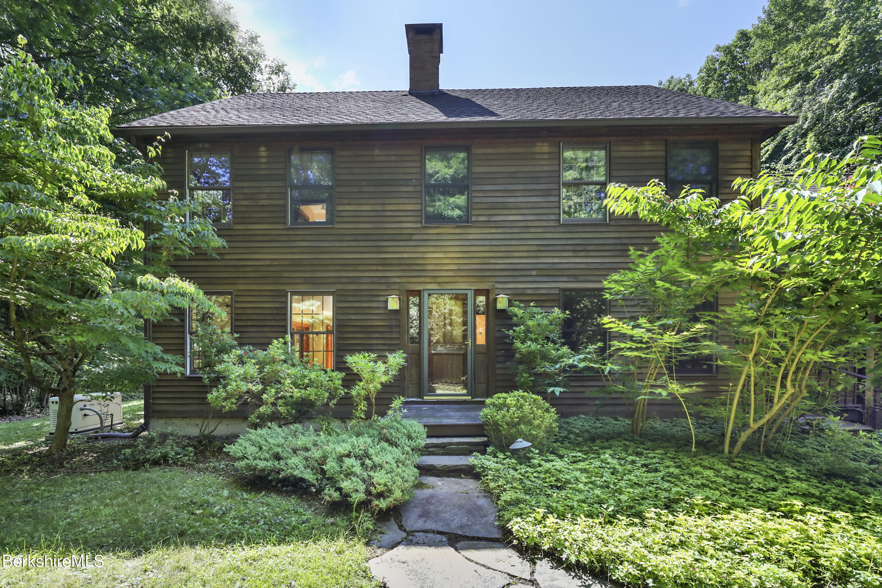 7 Fern Hill Road Great Barrington, MA 01230 - Photo 3 of 60 a front view of a house with garden