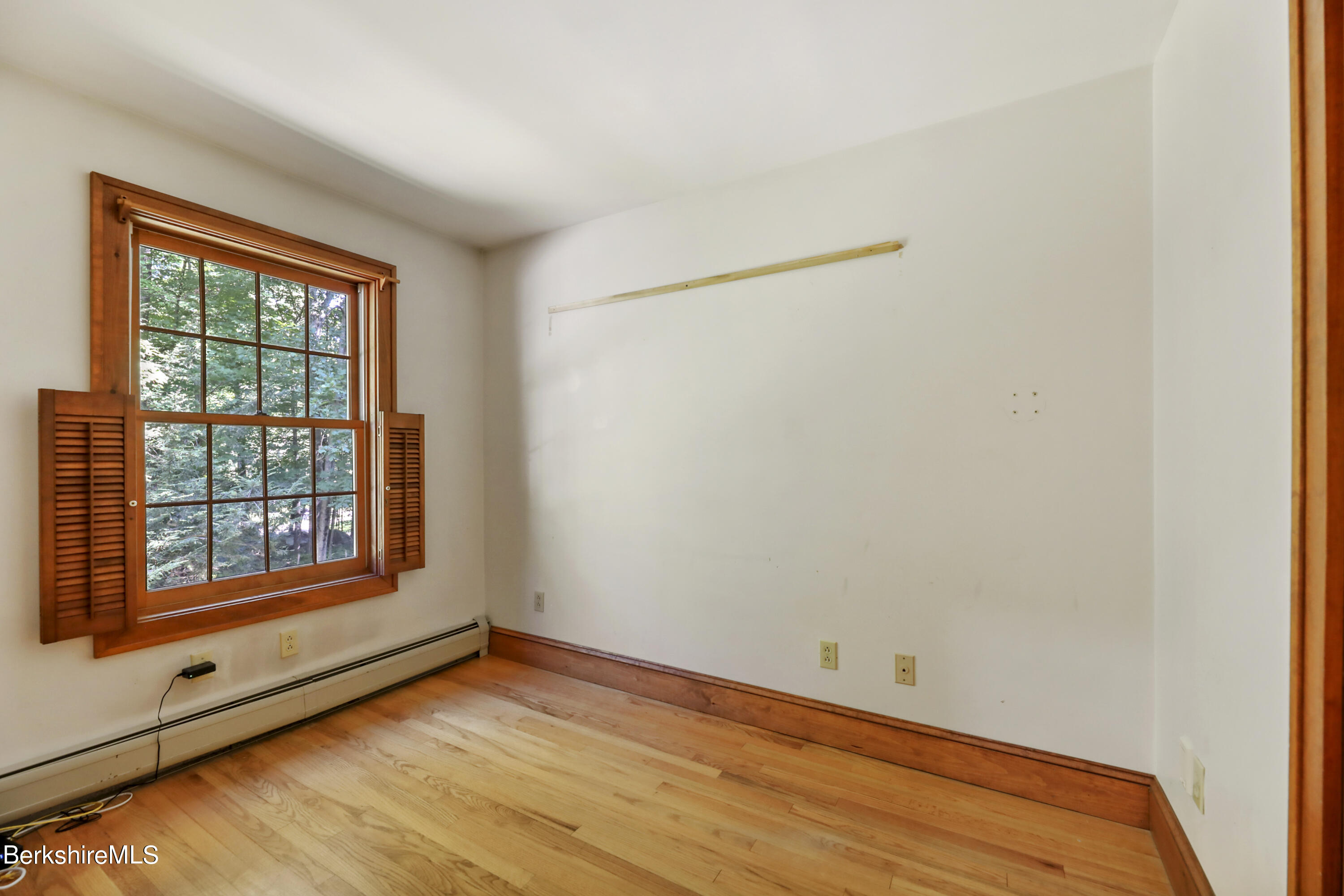 7 Fern Hill Road Great Barrington, MA 01230 - Photo 37 of 60 a view of empty room with wooden floor and fan