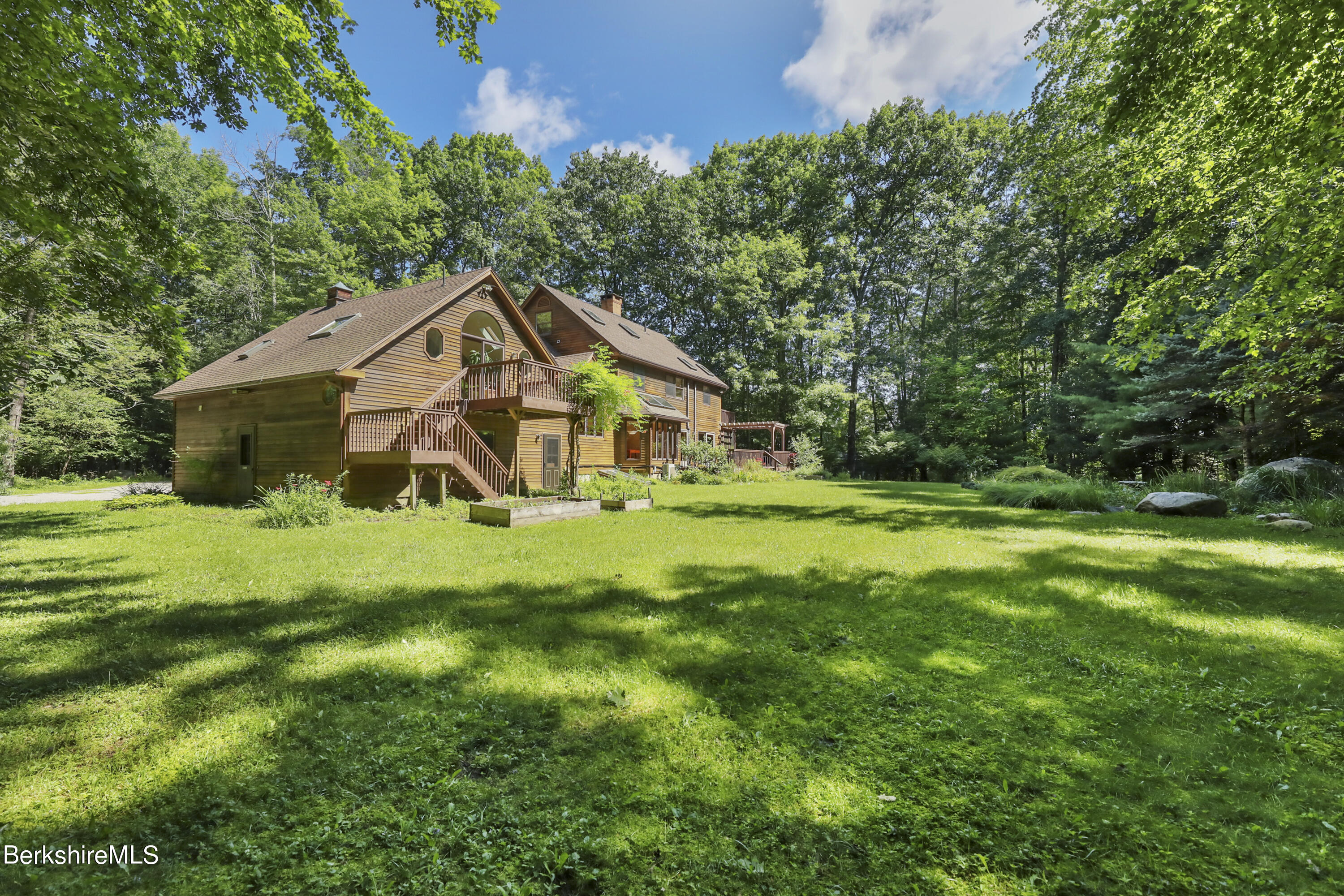 7 Fern Hill Road Great Barrington, MA 01230 - Photo 5 of 60 a front view of a house with garden