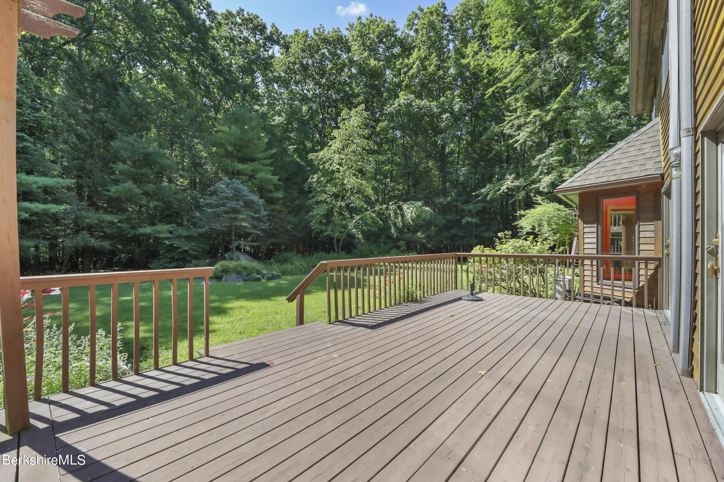 7 Fern Hill Road Great Barrington, MA 01230 - Photo 52 of 60 a view of a wooden deck with a yard