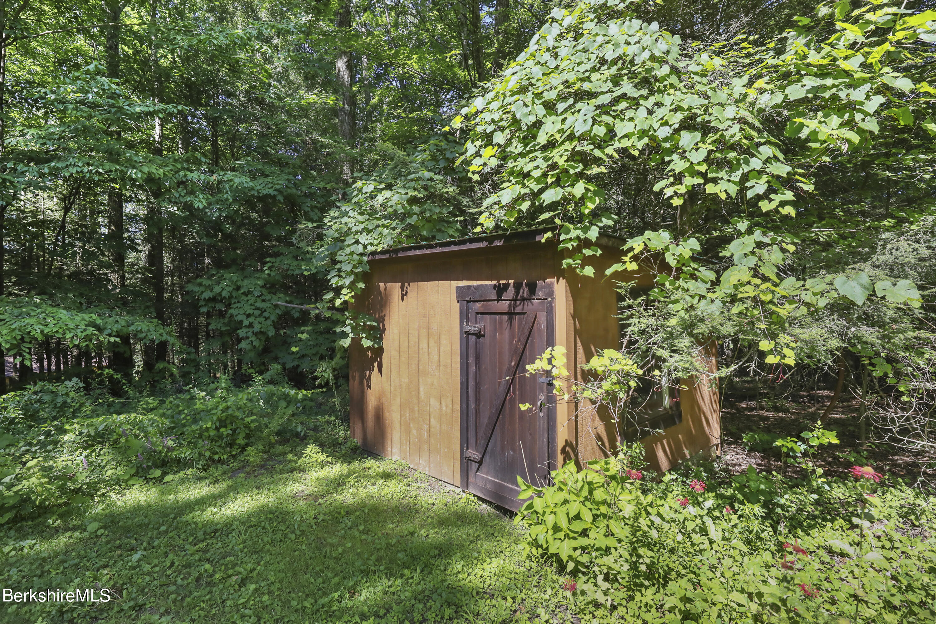 7 Fern Hill Road Great Barrington, MA 01230 - Photo 56 of 60 a backyard of a house with lots of green space and garden