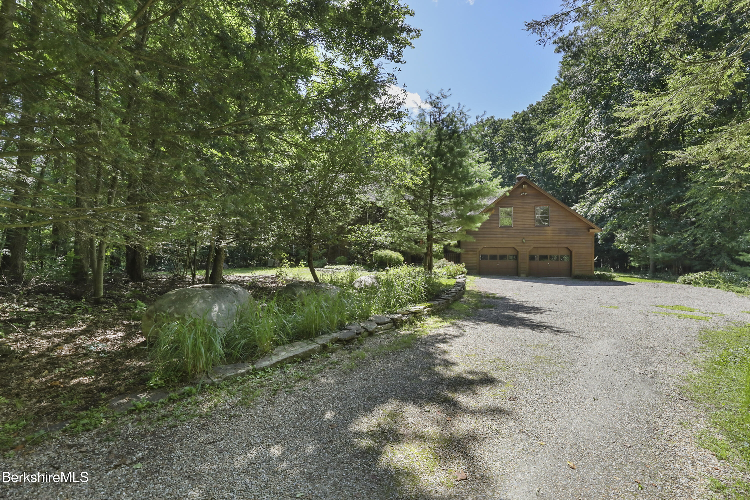 7 Fern Hill Road Great Barrington, MA 01230 - Photo 57 of 60 a front view of a house with a yard and tree s