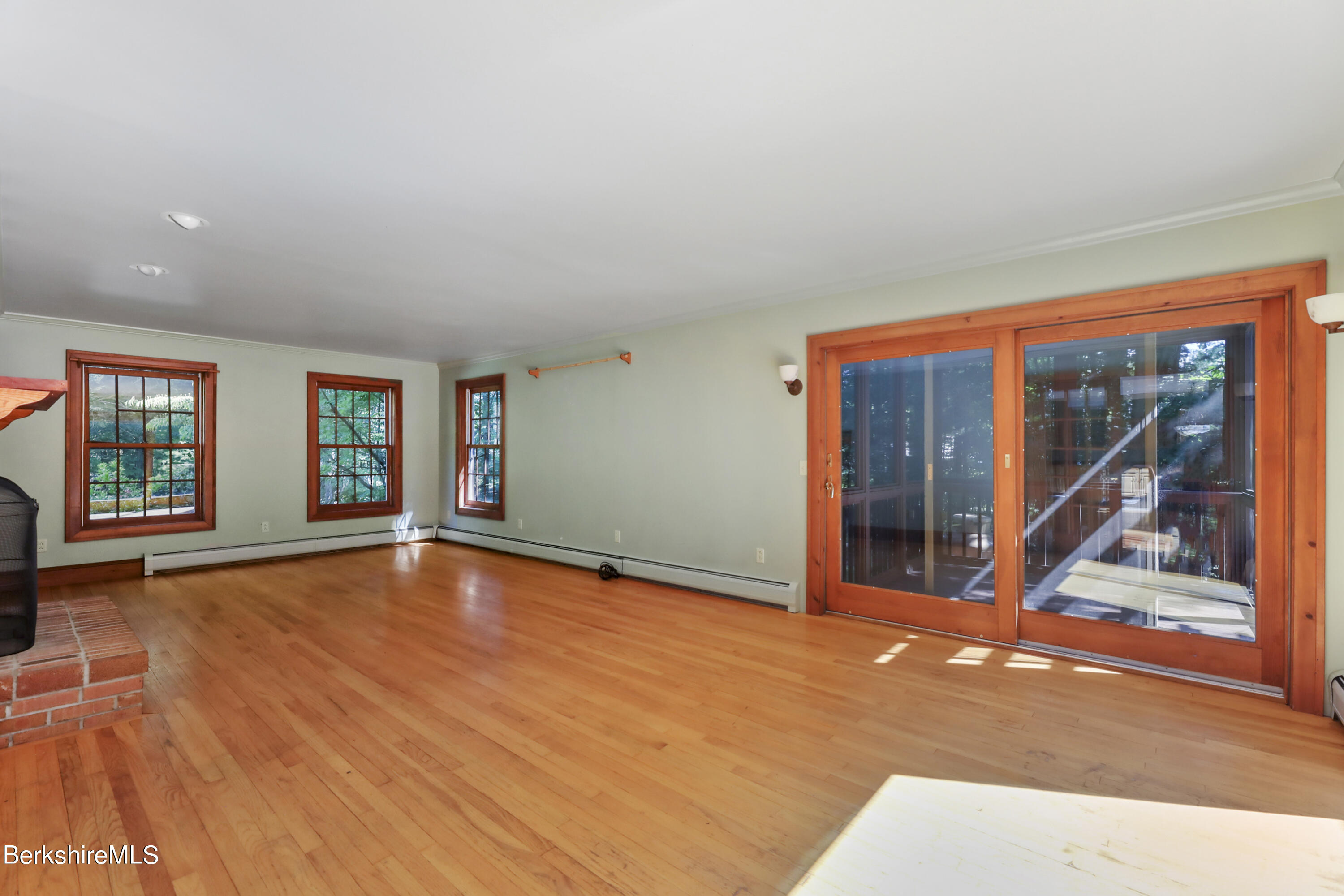 7 Fern Hill Road Great Barrington, MA 01230 - Photo 9 of 60 a view of an empty room with window and wooden floor