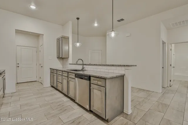a bathroom with a double vanity sink a mirror and a shower