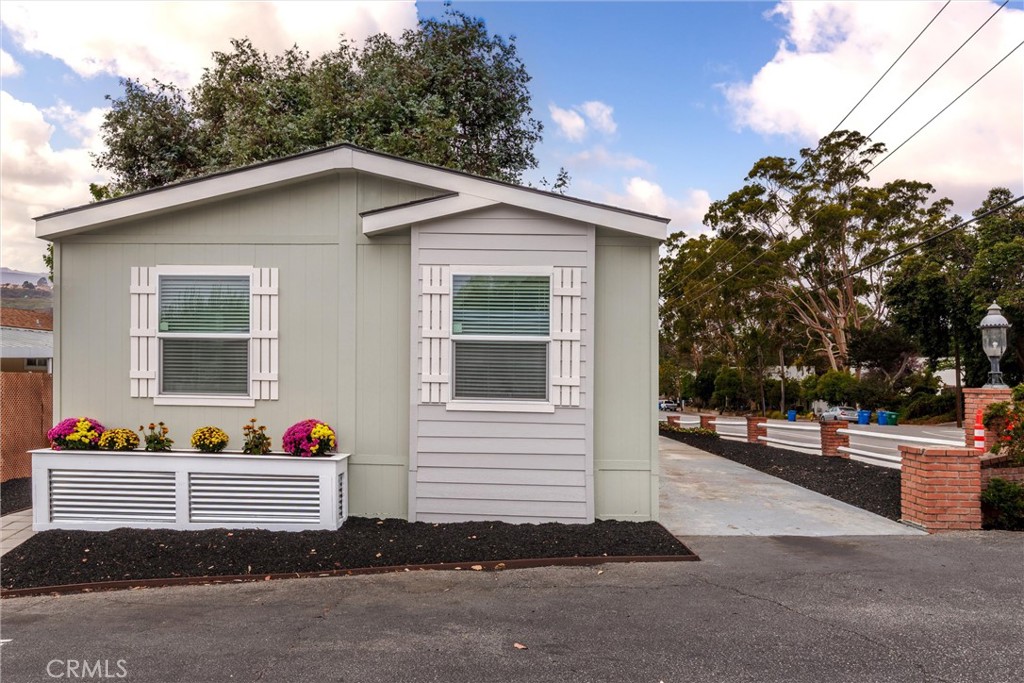 1255 Orcutt Road, Unit A11 San Luis Obispo, CA 93401 - Photo 4 of 22 a front view of house with yard and trees around