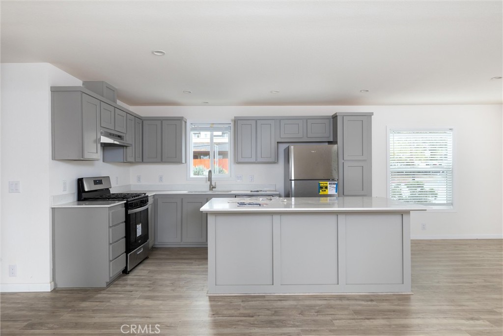 1255 Orcutt Road, Unit A11 San Luis Obispo, CA 93401 - Photo 8 of 22 a kitchen with stainless steel appliances granite countertop a sink stove and refrigerator