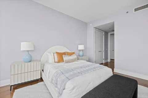 a bedroom with a bed and with furniture