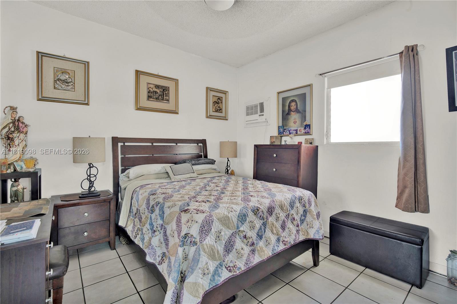 829 Southwest 19th Avenue Miami, FL 33135 - Photo 22 of 54 a bedroom with a bed and wooden floor