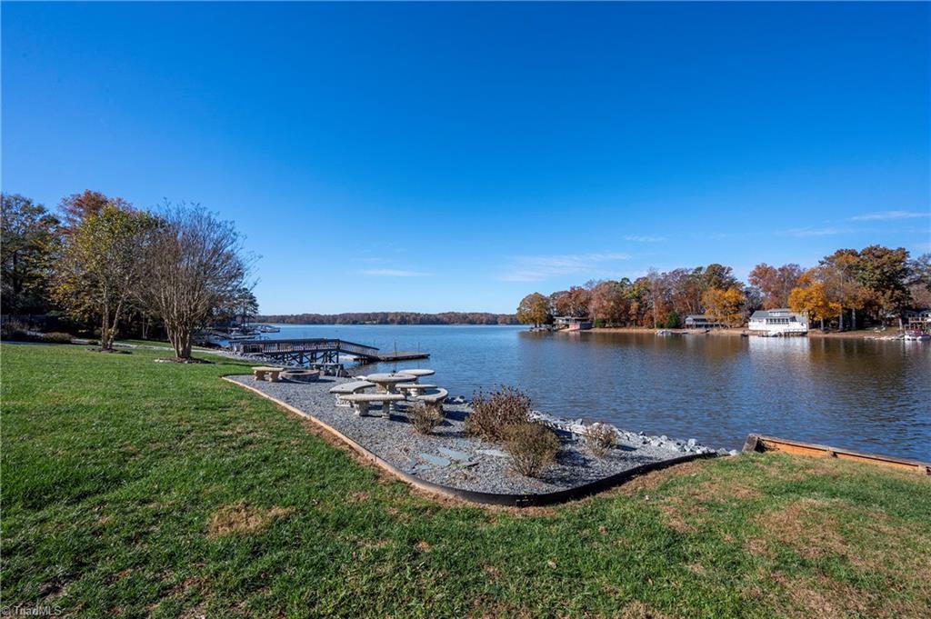 1851 Waterford Pointe Road Lexington, NC 27292 - Photo 1 of 49 Recreation area by the lake with a firepit and sitting area.