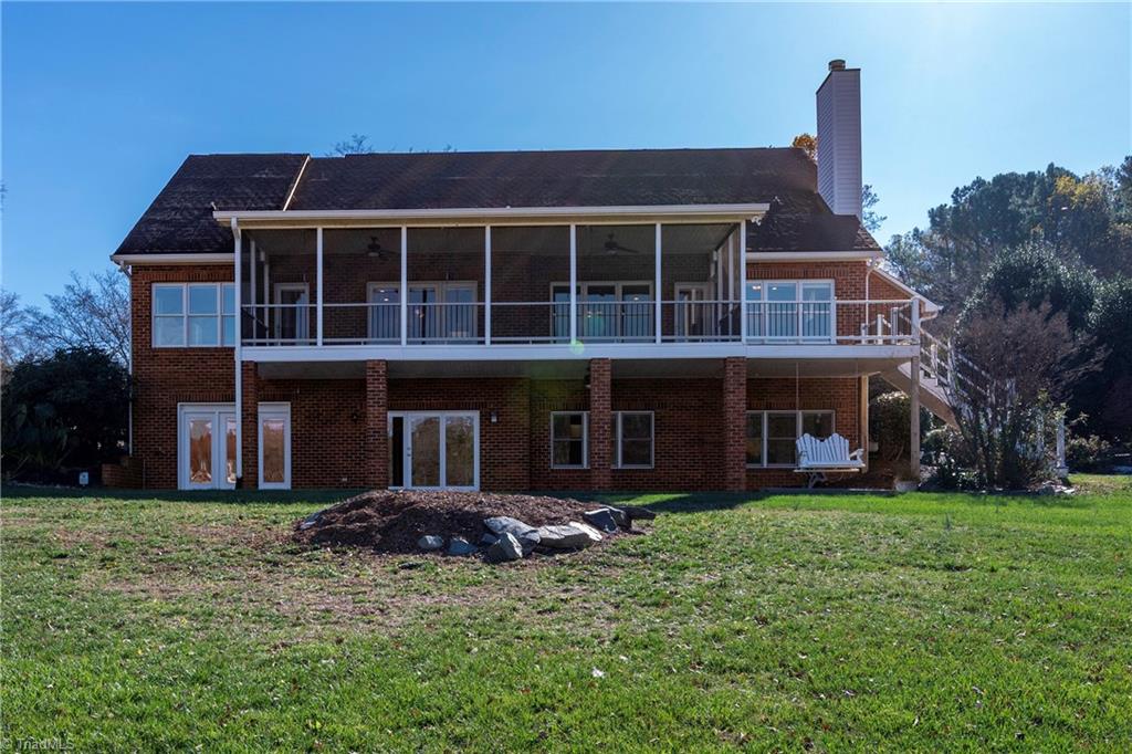 1851 Waterford Pointe Road Lexington, NC 27292 - Photo 11 of 49 There is a grilling deck to the right of the screened porch with stairs to acess the lake