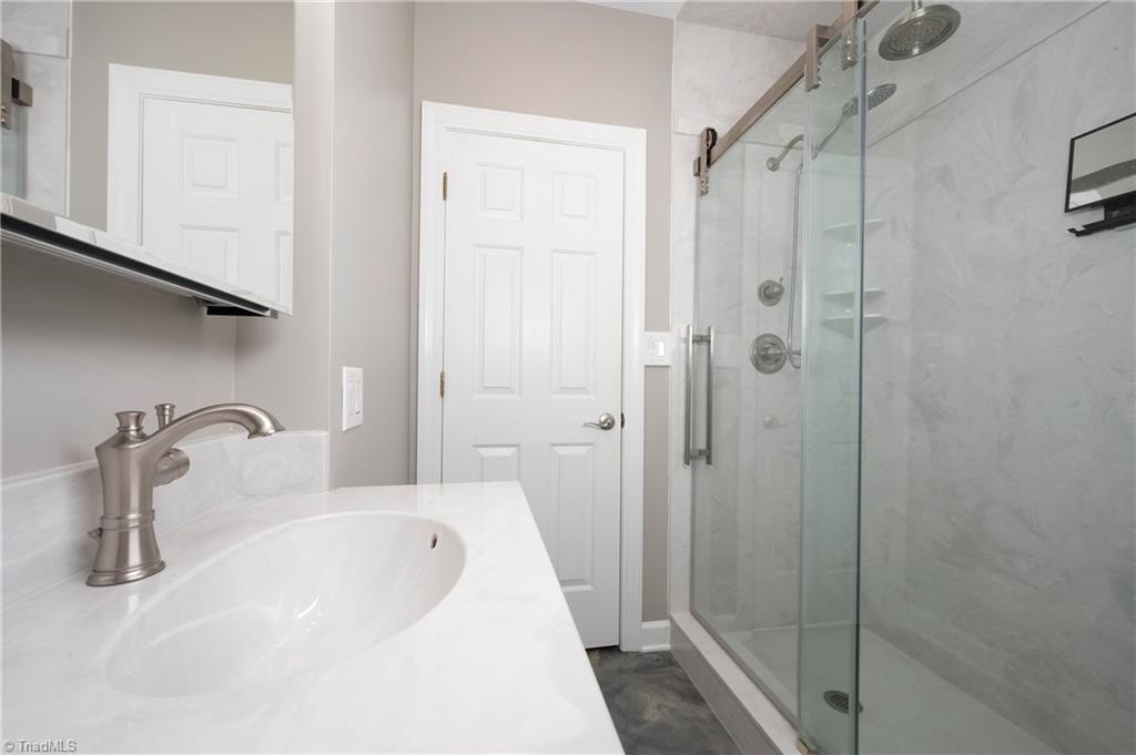 1851 Waterford Pointe Road Lexington, NC 27292 - Photo 36 of 49 Full bath on the lower level with a spacious shower and double shower heads