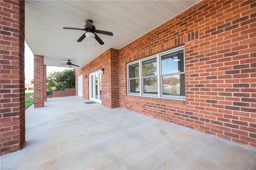 1851 Waterford Pointe Road Lexington, NC 27292 - Photo 45 of 49 Large patio area under the screened porch. There is access from the Den and the finished room not in the SF