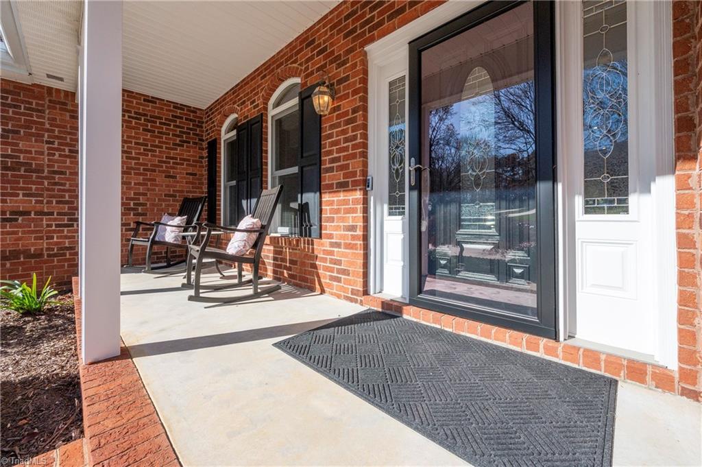 1851 Waterford Pointe Road Lexington, NC 27292 - Photo 9 of 49 Rocking chair front porch, notice the leaded glass front door and side panels.