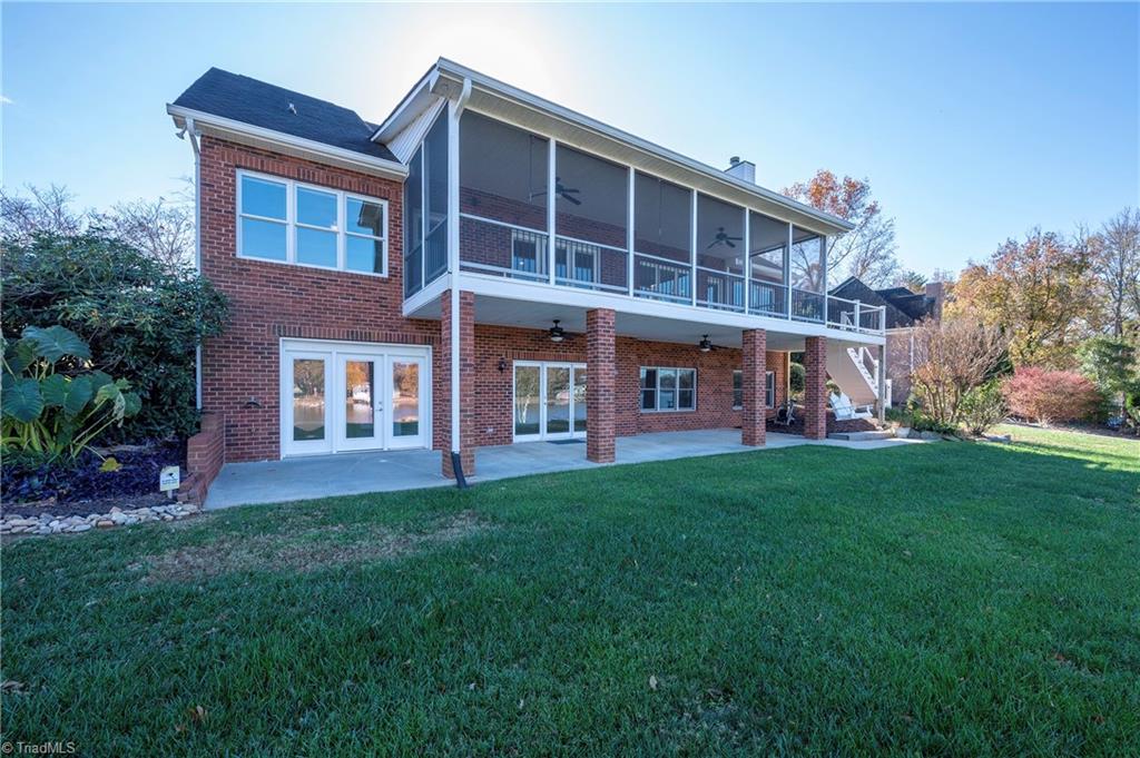 1851 Waterford Pointe Road Lexington, NC 27292 - Photo 10 of 49 Lake side view of the house shows the expansive screened porch and lower level patio