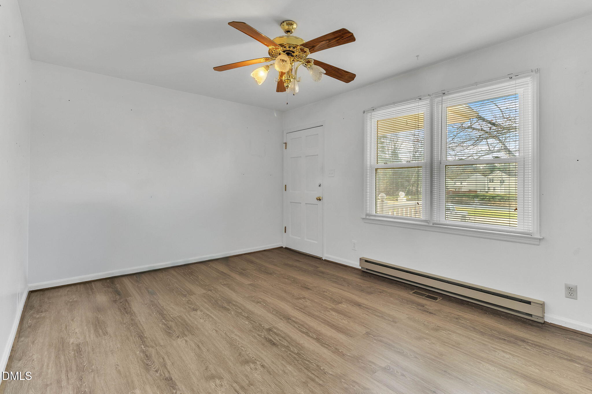 1828 Fletchers Chapel Road Durham, NC 27703 - Photo 13 of 36 an empty room with windows and fan