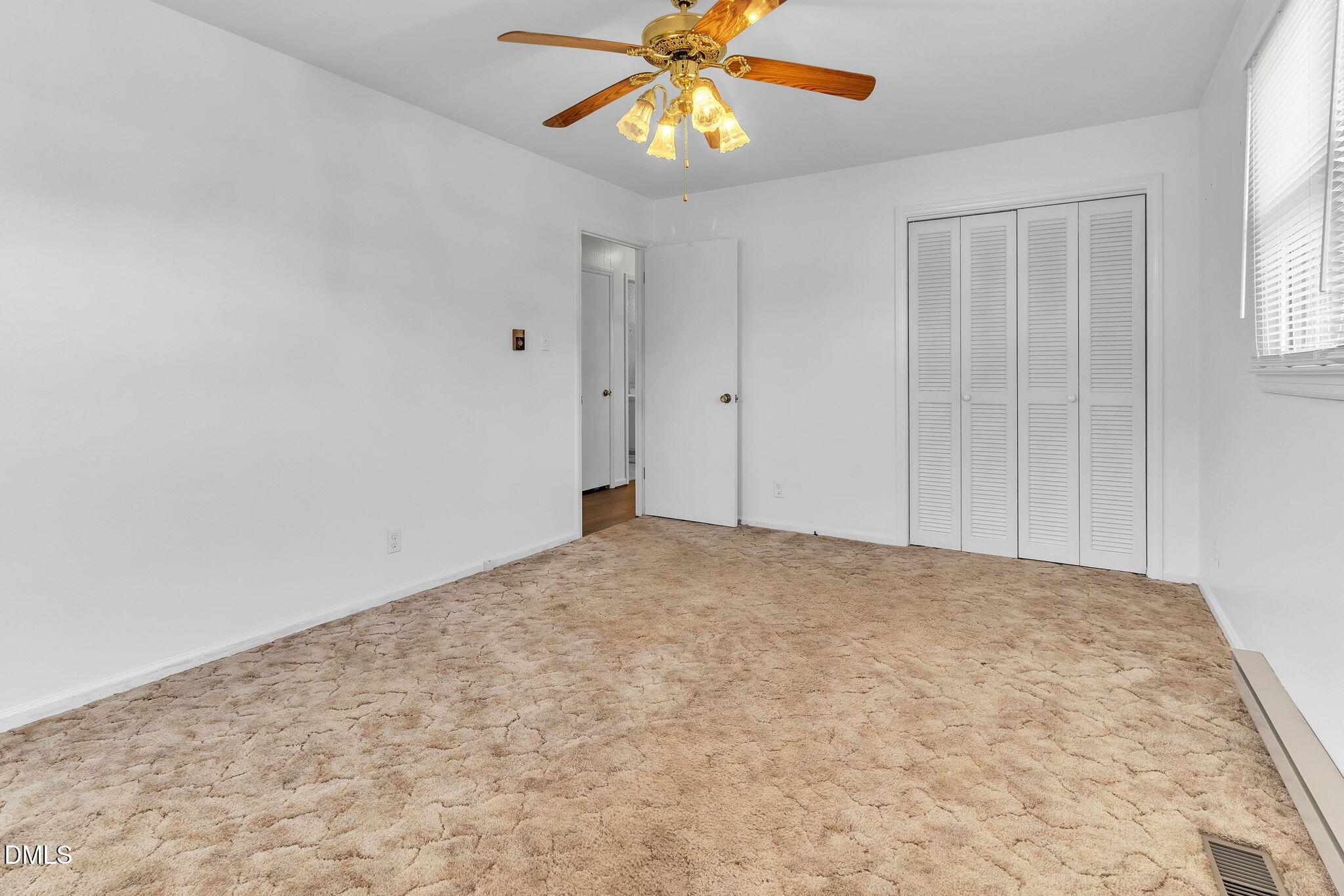 1828 Fletchers Chapel Road Durham, NC 27703 - Photo 18 of 36 a view of an empty room and chandelier fan