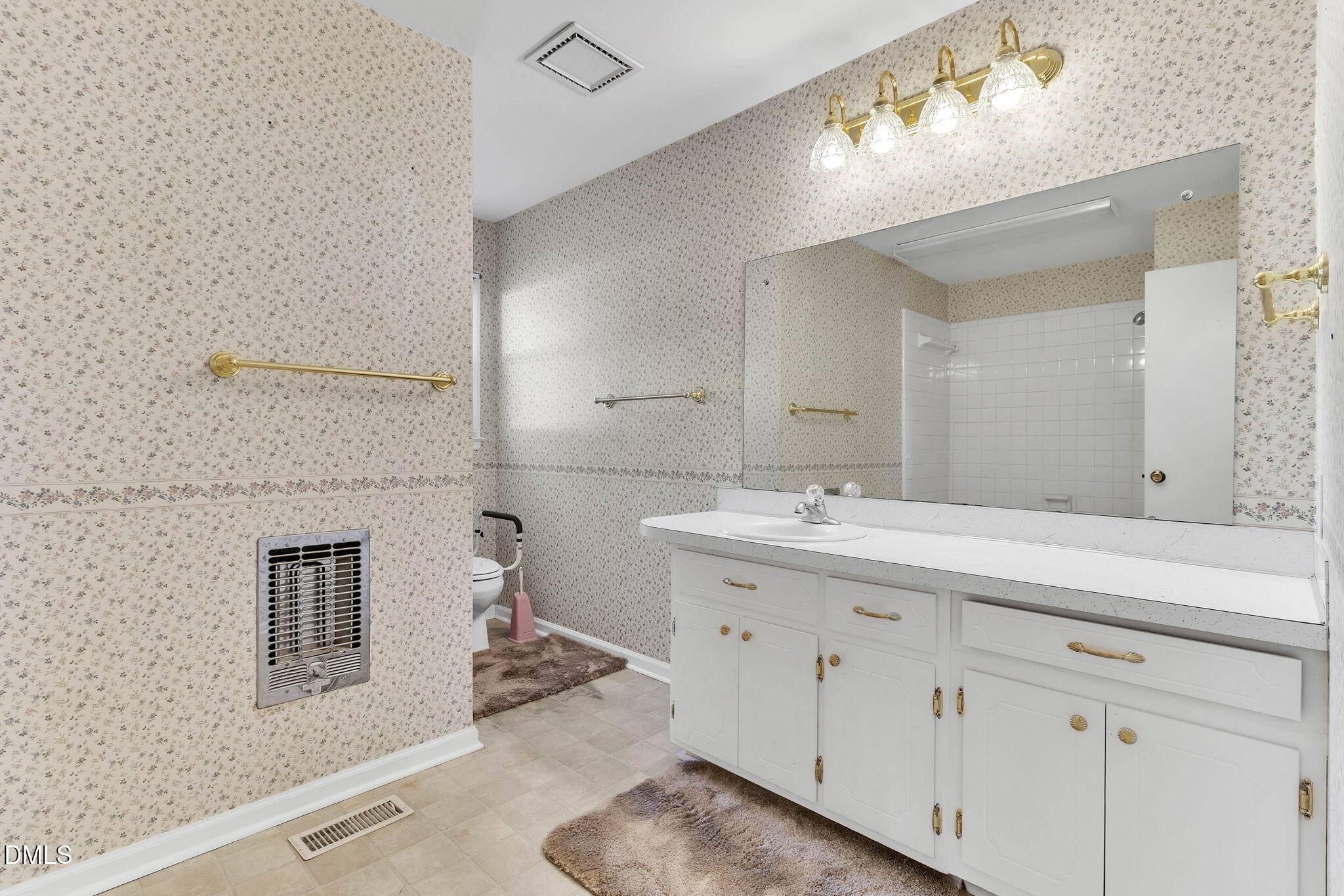 1828 Fletchers Chapel Road Durham, NC 27703 - Photo 21 of 36 a bathroom with a double vanity sink mirror and