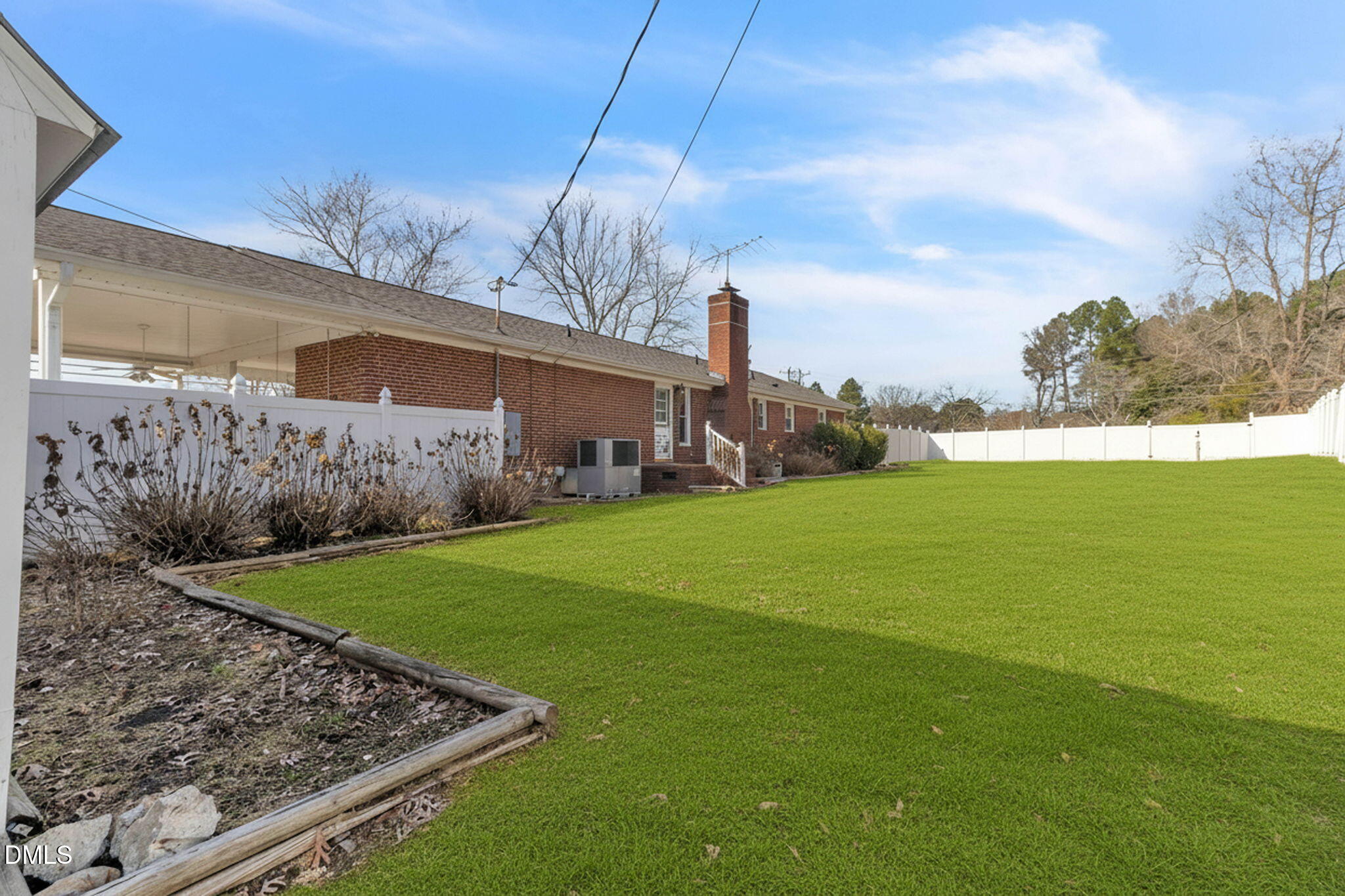 1828 Fletchers Chapel Road Durham, NC 27703 - Photo 29 of 36 a view of a backyard with plants and a lake view