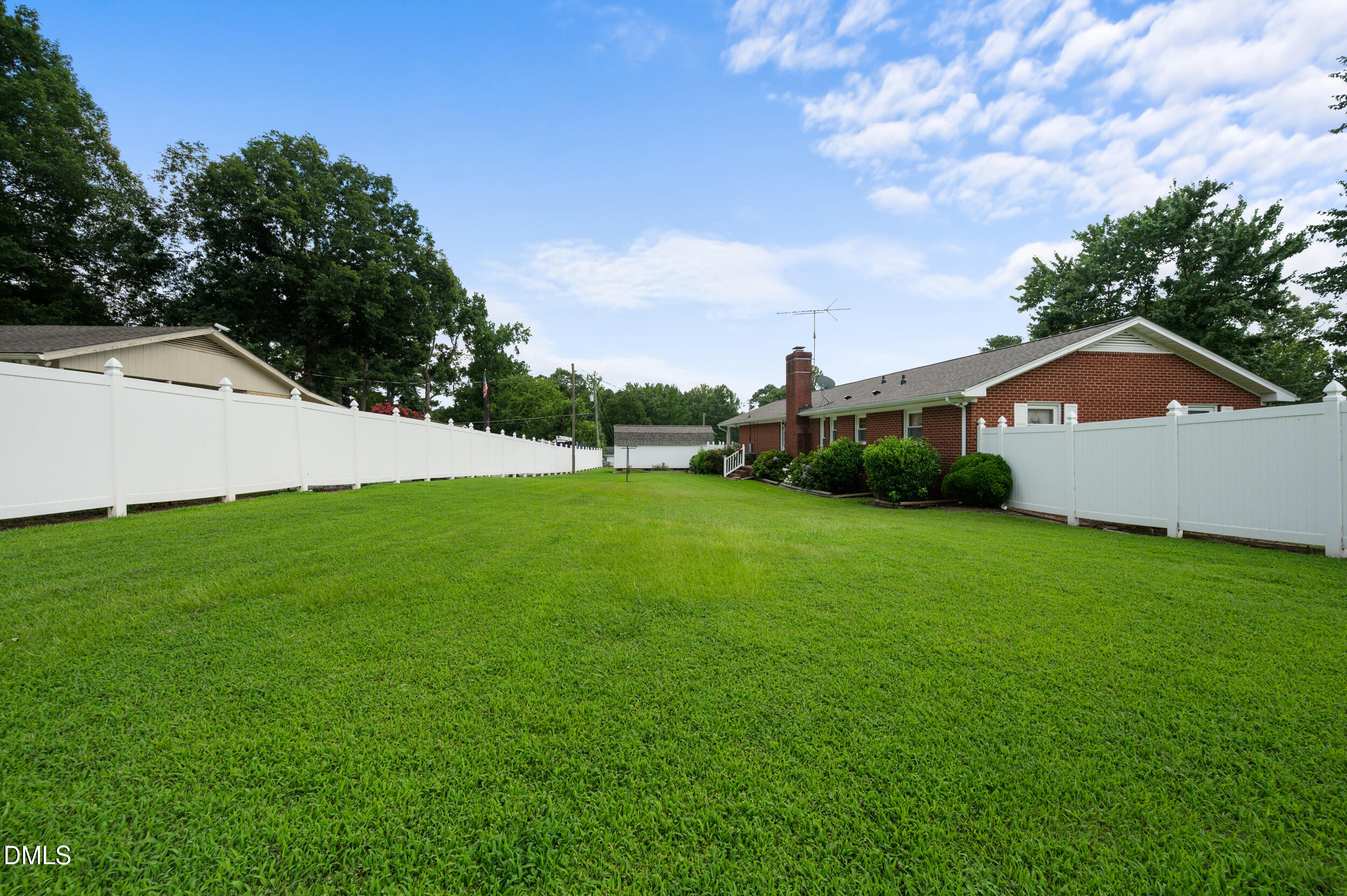 1828 Fletchers Chapel Road Durham, NC 27703 - Photo 36 of 36 a view of green field with house in the background
