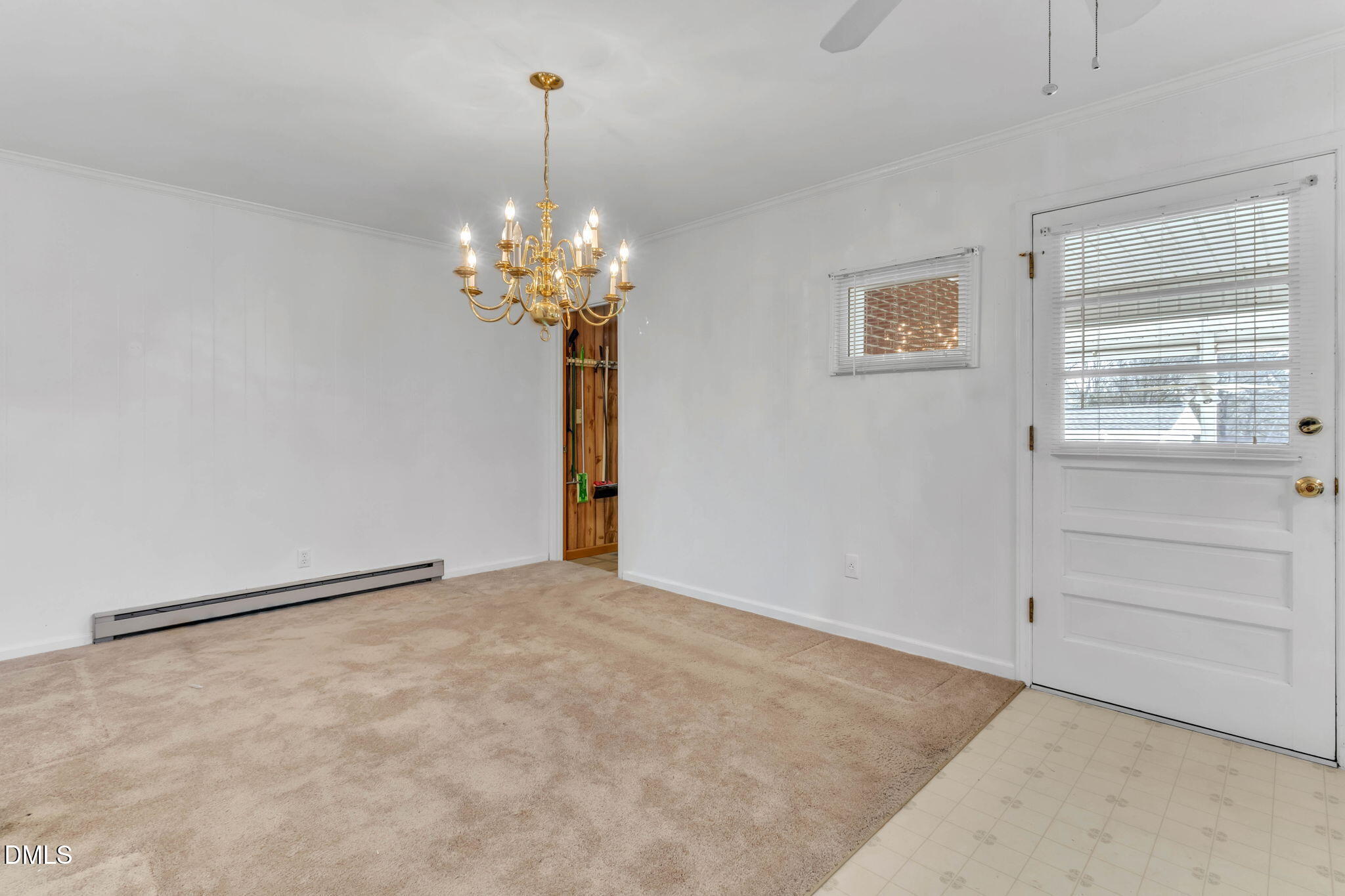 1828 Fletchers Chapel Road Durham, NC 27703 - Photo 5 of 36 a view of an empty room with a window