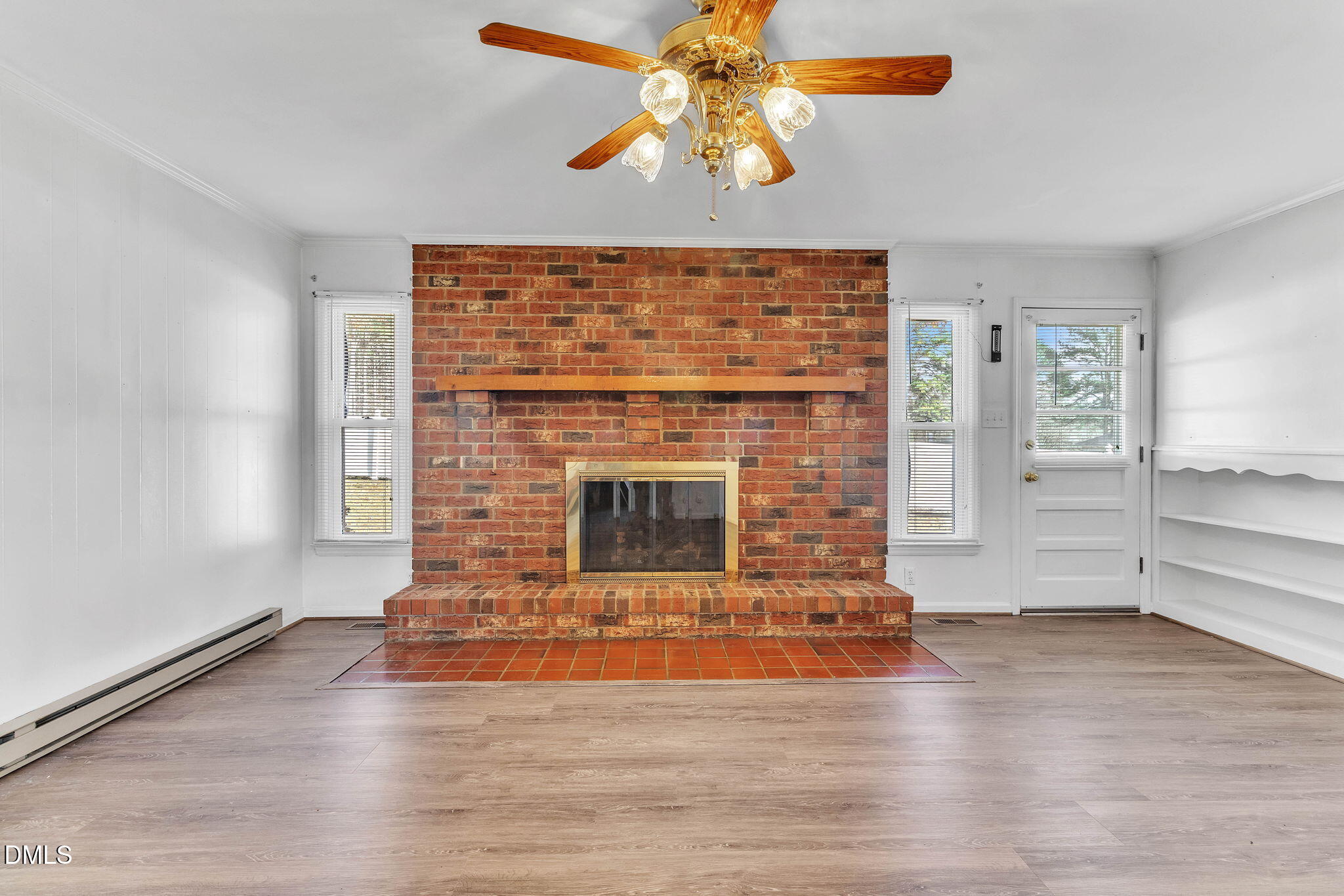 1828 Fletchers Chapel Road Durham, NC 27703 - Photo 9 of 36 a living room with a fireplace