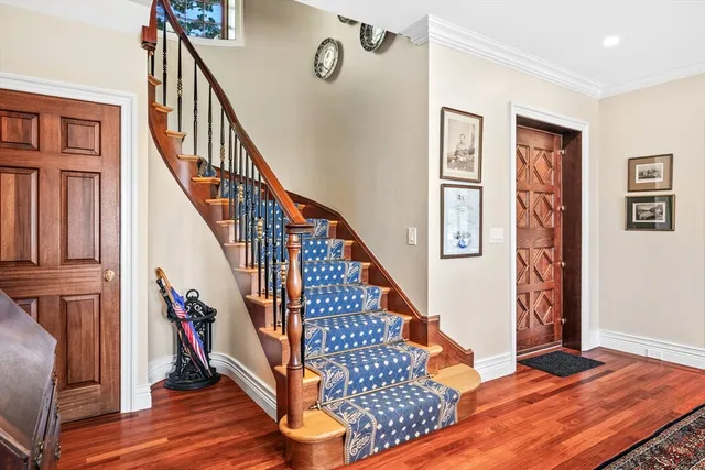 a view of staircase with wooden floor and staircase
