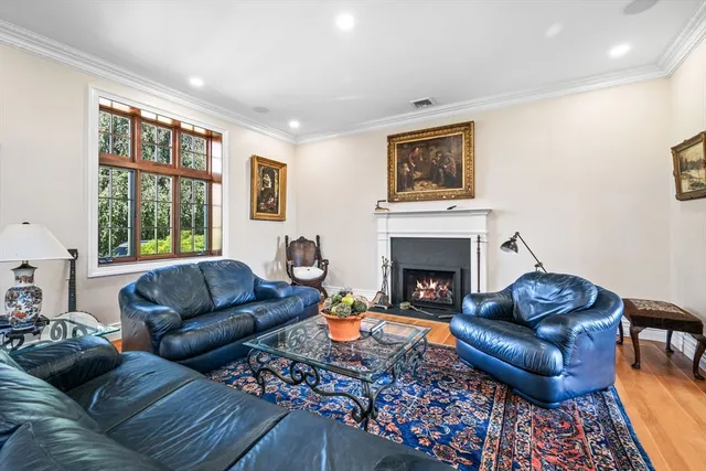 a living room with furniture fireplace and window