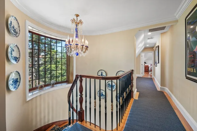 a bedroom with a large bed a couch and a window