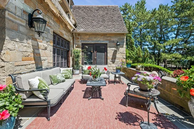 a view of a patio with table and chairs and potted plants