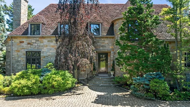 a aerial view of a house with plants and garden