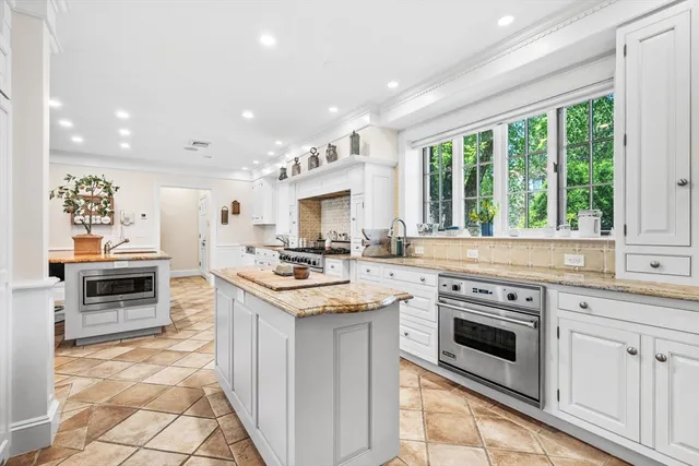 a kitchen with a stove a sink and a refrigerator