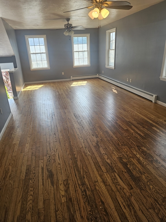 40 Merrick Street, Unit A Worcester, MA 01609 - Photo 6 of 32 an empty room with wooden floor and windows