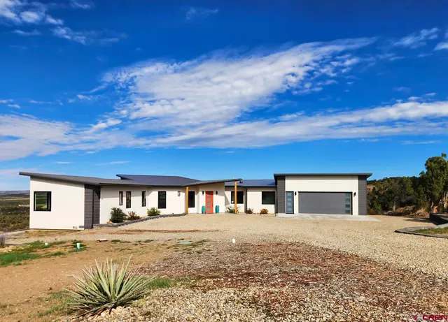 a front view of house with yard