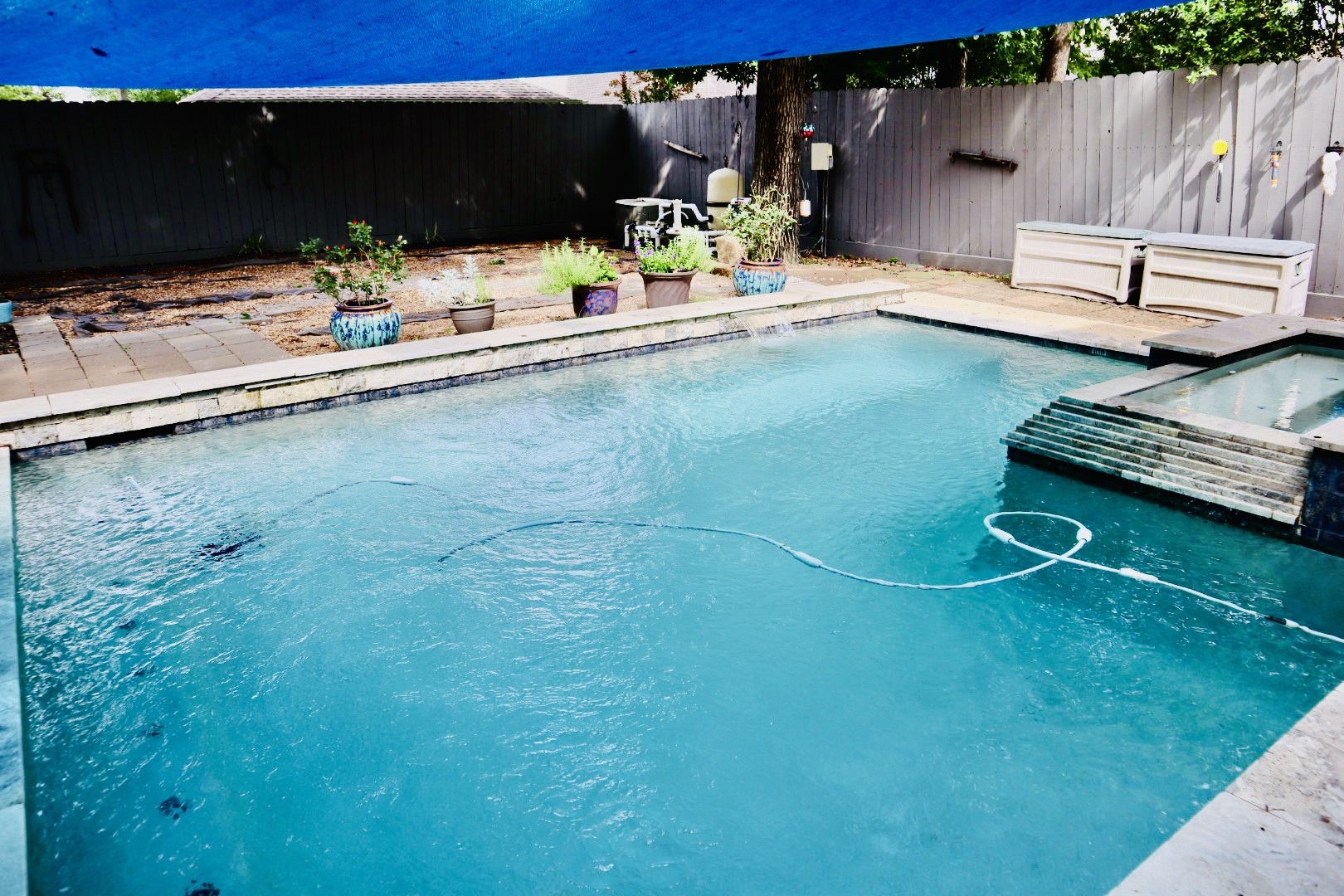19114 Emory Trail Spring, TX 77388 - Photo 29 of 32 This backyard features a refreshing swimming pool with an adjacent hot tub. The area is enclosed by a privacy fence. Perfect for outdoor relaxation and entertainment.