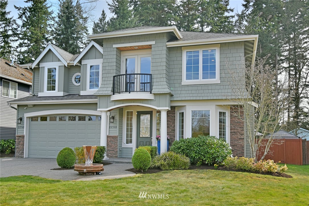 22548 5th Place West Bothell, WA 98021 - Photo 1 of 38 a front view of a house with garden