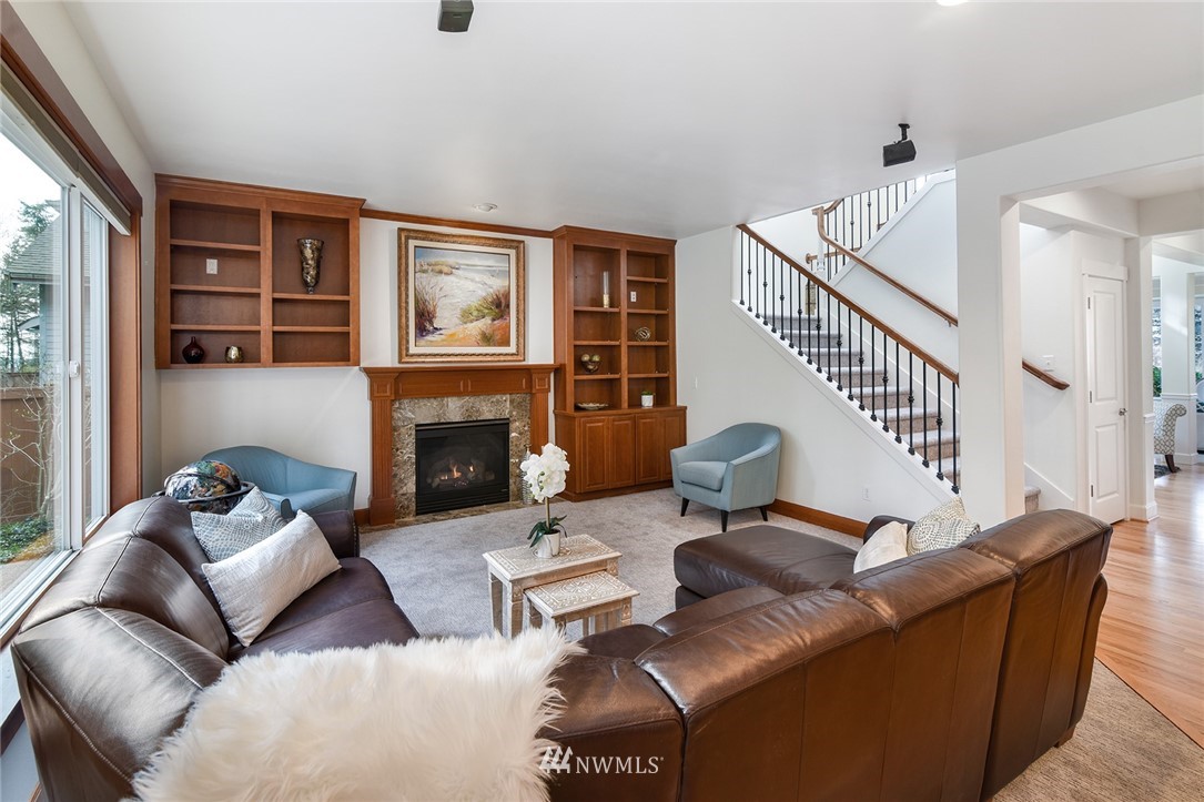 22548 5th Place West Bothell, WA 98021 - Photo 15 of 38 a living room with furniture wooden floor and a fireplace