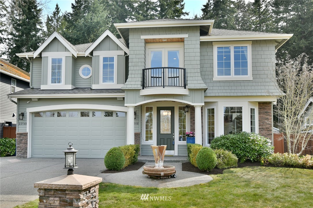 22548 5th Place West Bothell, WA 98021 - Photo 3 of 38 a front view of a house with garden